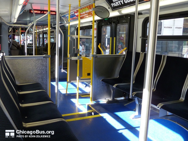 The interior of bus #4162 at State and Madison, working route #147 Outer Drive Express, on July 18, 2010. Numbers 4149-2207 switched to a longitudinal seating arrangement with Aries 4MA seats.