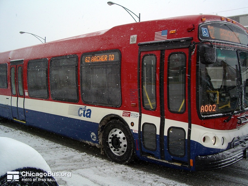 Prototype bus #7800 at Archer and Spaulding working route #62 Archer on January 22, 2005. The bus featured a modified paint scheme, with red as the dominant color.