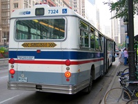 Bus #7324 at Michigan Monroe, working route #6 Jackson Park Express, on August  5, 2003.