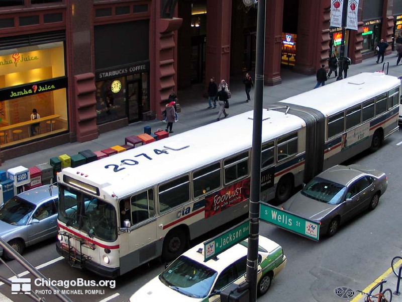 Bus #7396 at Jackson and Wells on March  9, 2004. Ex-King County Metro #2074.
