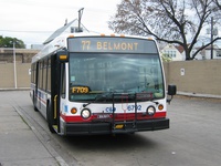Bus #6792 at Belmont Blue Line Station, working route #77 Belmont, on October 23, 2003.