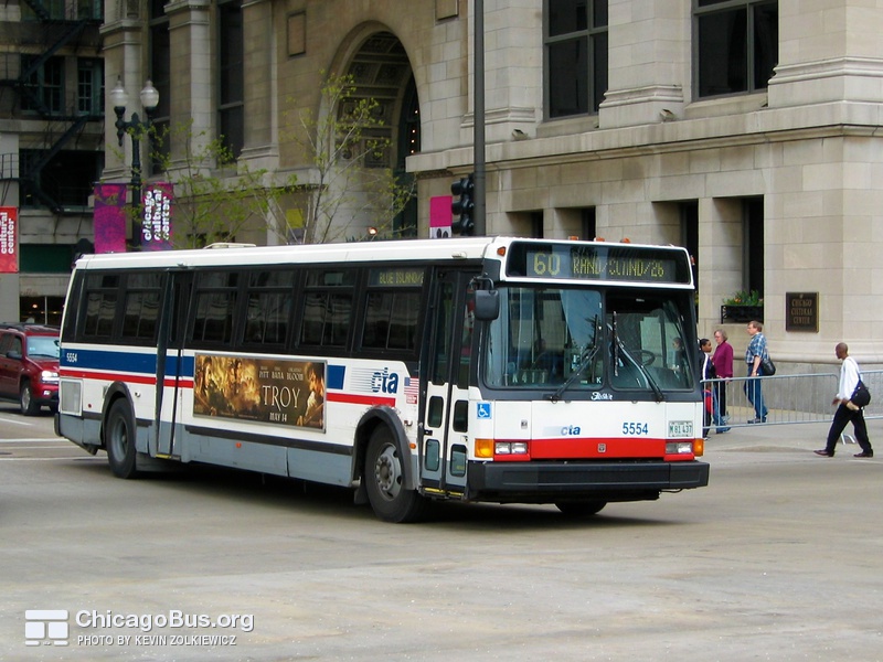 Bus #5554 at Michigan and Washington, working route #60 Blue Island/26th, on April 28, 2004. Note the missing bike rack.