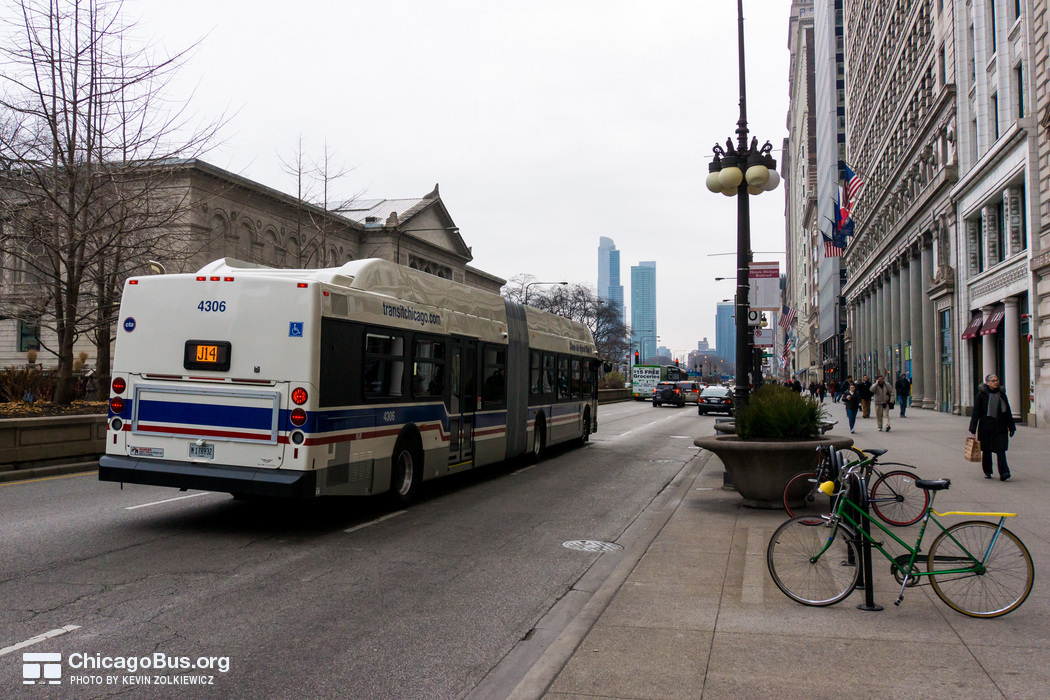 Bus #4306 at Michigan and Monroe, working route #J14 Jeffery Jump, on December 19, 2012.