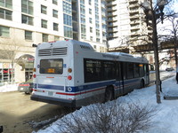 Bus #7900 at CTA Headquarters on February 18, 2014. The rear of Nova's newer LFS model has seen the most significant design change compared to CTA's 2000-2002 models. The engine is now placed horizontally to allow for an improved seating arrangement and a larger rear window.
