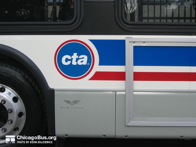 Prototype bus #1000 at Navy Pier during a CTA press conference on November 2, 2005. The 1000-series features the new CTA "dot" logo.
